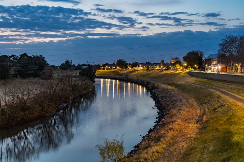 Hunter-River-in-Maitland-714px Twilight view of the Hunter river in maitland winding past a suburban area with illuminated homes and paths