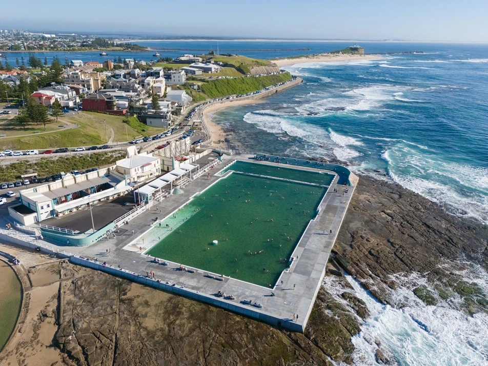 Newcastle-Beach-Baths-714 Aerial view of Newcastle coastline featuring Newcastle Ocean Baths and surrounding suburbs